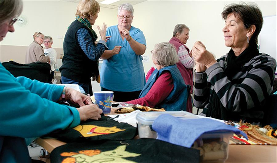 A consumer event with people deep in conversation.